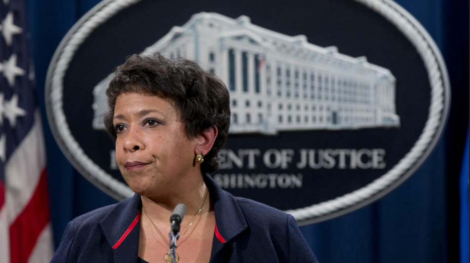 Attorney General Loretta Lynch pauses as she speaks during a news conference at the Justice Department in Washington about Ferguson, Missouri. The federal government sued Ferguson on Wednesday, one day after the city council voted to revise an agreement aimed at improving the way police and courts treat poor people and minorities in the St. Louis suburb. (Carolyn Kaster / AP)