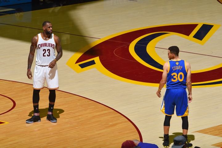 LeBron James #23 of the Cleveland Cavaliers stands on the court with Stephen Curry #30 of the Golden State Warriors in Game Four of the 2016 NBA Finals on June 10, 2016 at Quicken Loans Arena in Cleveland, Ohio. Jesse D. Garrabrant/NBAE via Getty Images